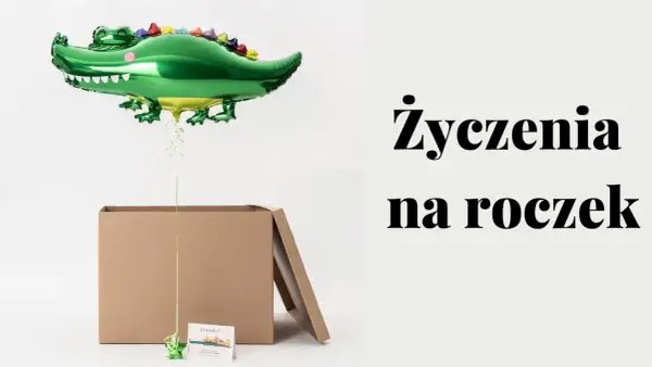 Zielony balon w kształcie krokodyla unosi się nad otwartym kartonem. Obok kartka z napisem "Franku!" i tekst "Życzenia na roczek".